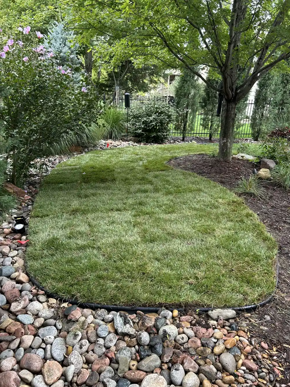 Professional bed maintenance and mulch refresh in Wichita Kansas by Prestige Lawn Care